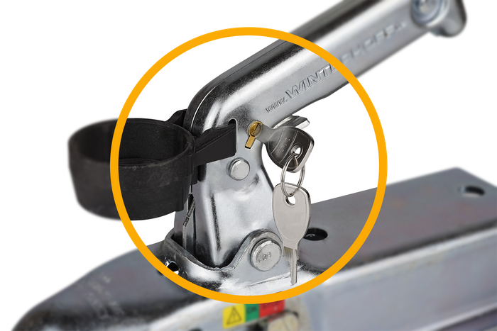 Låseinnsats som sikrer Unitrailer-spjeldet